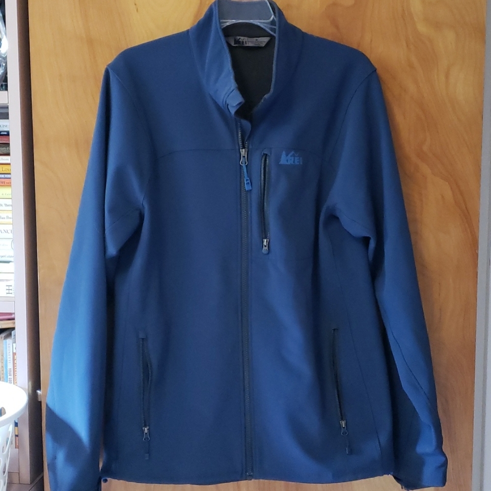 REI  water proof jacket. 3 outside zipped pockets